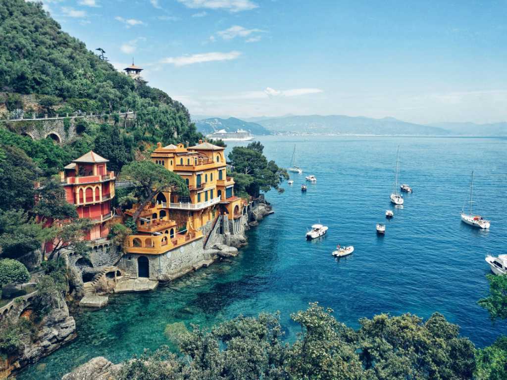 Portofino, Italy sea shore cliffs overlooking blue water.